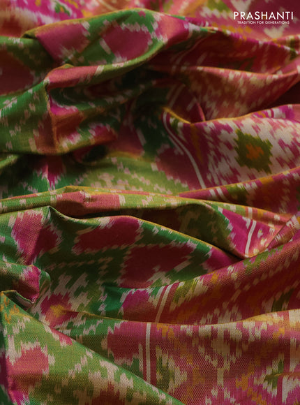 Rajkot patola tissue silk saree green and pink with allover ikat weaves and ikat woven zari border