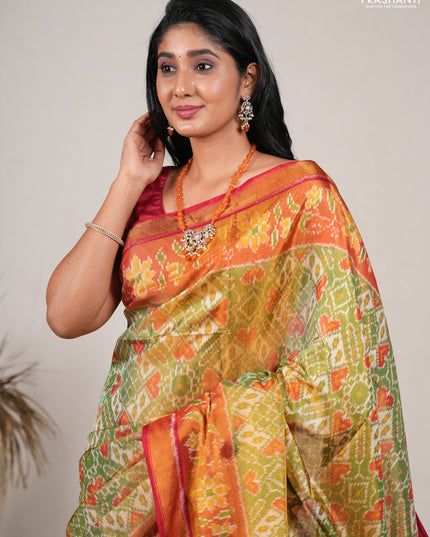 Rajkot patola silk saree green and red with allover ikat weaves and ikat woven zari border