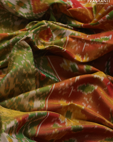 Rajkot patola silk saree green and red with allover ikat weaves and ikat woven zari border