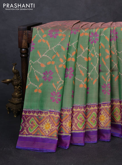 Rajkot patola silk saree dual shade of green and purple with allover ikat weaves and ikat woven zari border