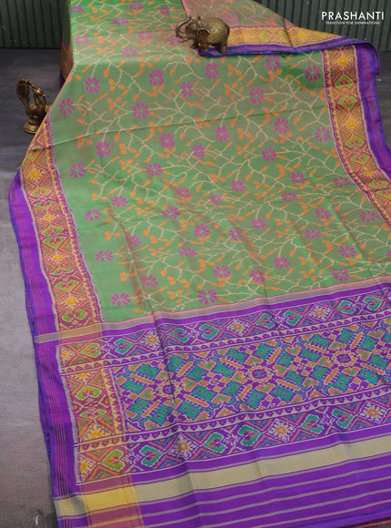 Rajkot patola silk saree dual shade of green and purple with allover ikat weaves and ikat woven zari border