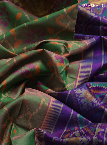 Rajkot patola silk saree dual shade of green and purple with allover ikat weaves and ikat woven zari border
