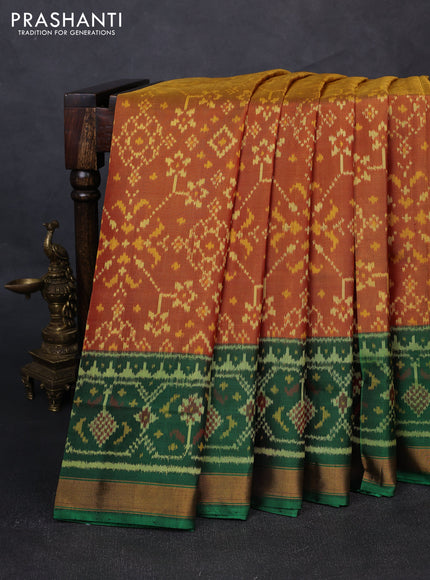 Rajkot patola silk saree dual shade of dark mustard and purple green with allover ikat weaves and ganga jamuna border