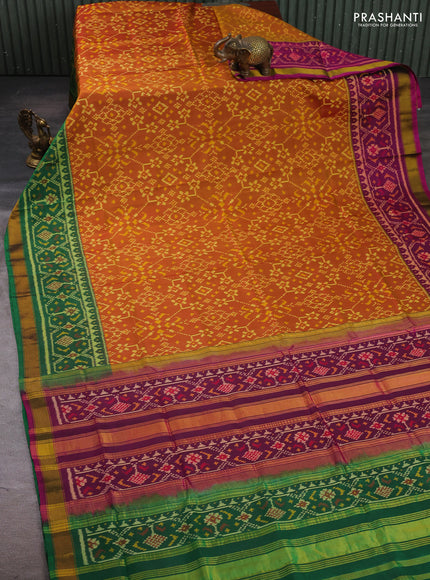 Rajkot patola silk saree dual shade of dark mustard and purple green with allover ikat weaves and ganga jamuna border
