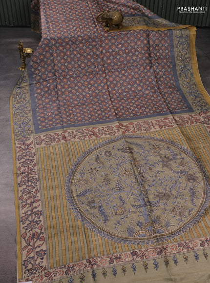 Matka tussar saree grey and elaichi green with allover ajrakh prints & mirror work and kalamkari prints & embroidery pallu
