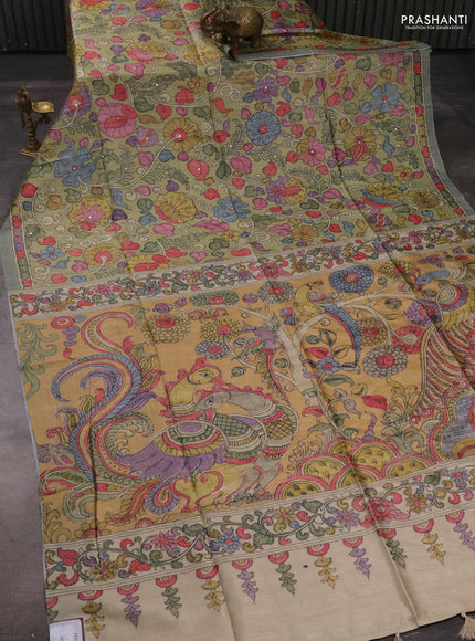 Matka tussar saree pista green and mustard yellow with allover kalamkari prints & mirror work and kalamkari prints & embroidery pallu