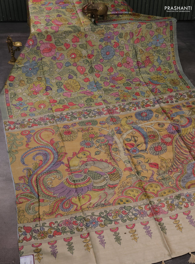 Matka tussar saree pista green and mustard yellow with allover kalamkari prints & mirror work and kalamkari prints & embroidery pallu