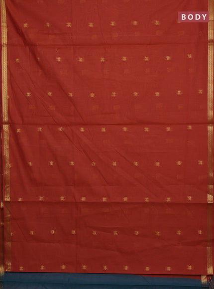 Semi maheswari cotton saree rust shade and peacock green with allover zari woven buttas and small zari woven border