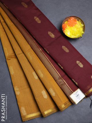 Semi maheswari cotton saree dark mustard and deep wine with allover zari woven buttas and small zari woven border
