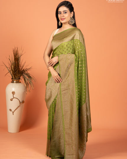 Banarasi semi crepe saree light green with woven buttas and woven border