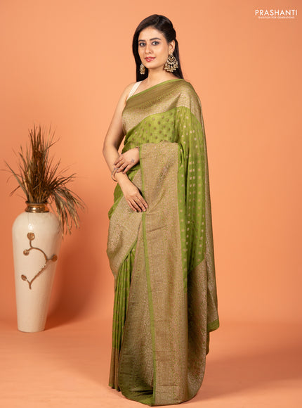 Banarasi semi crepe saree light green with woven buttas and woven border