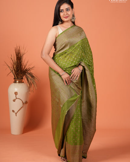 Banarasi semi crepe saree light green with woven buttas and woven border
