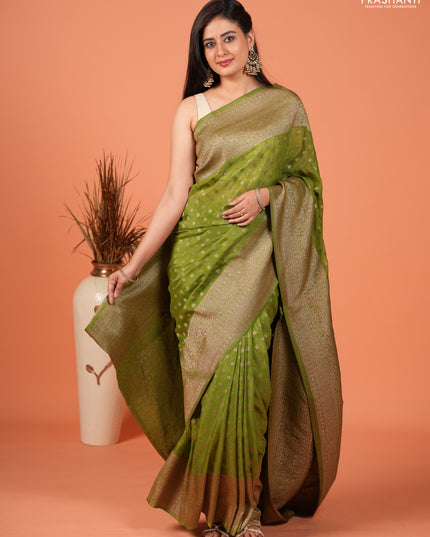 Banarasi semi crepe saree light green with woven buttas and woven border