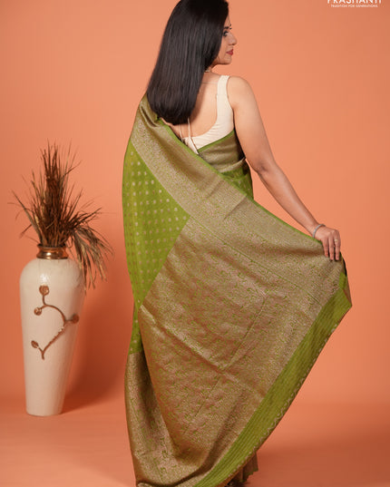 Banarasi semi crepe saree light green with woven buttas and woven border