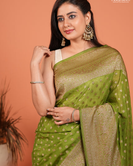 Banarasi semi crepe saree light green with woven buttas and woven border