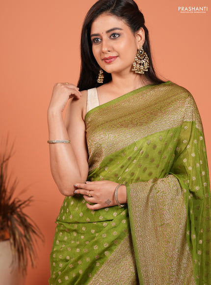 Banarasi semi crepe saree light green with woven buttas and woven border