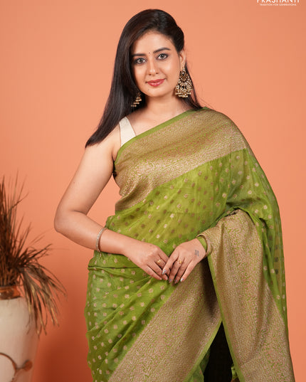 Banarasi semi crepe saree light green with woven buttas and woven border
