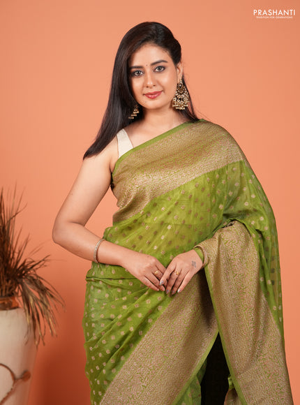Banarasi semi crepe saree light green with woven buttas and woven border