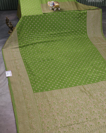 Banarasi semi crepe saree light green with woven buttas and woven border