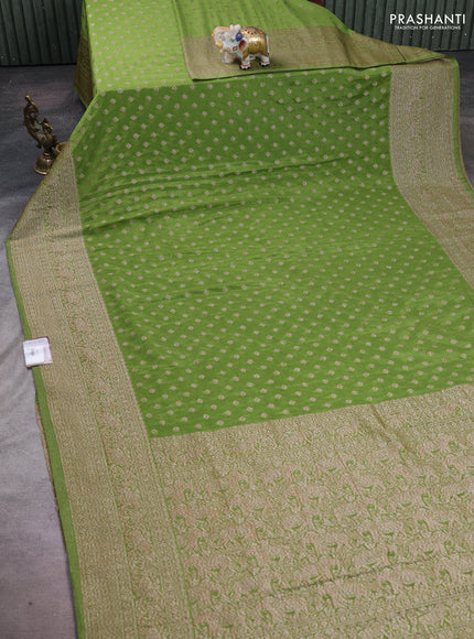 Banarasi semi crepe saree light green with woven buttas and woven border