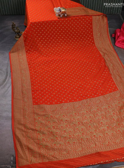 Banarasi semi crepe saree orange with woven buttas and woven border