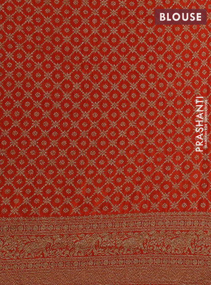 Banarasi semi crepe saree orange with woven buttas and woven border