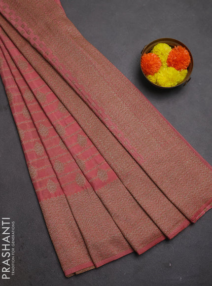 Banarasi semi crepe saree peach shade with allover thread & zari weaves and woven border