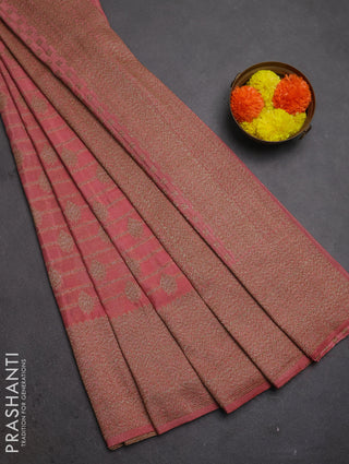 Banarasi semi crepe saree peach shade with allover thread & zari weaves and woven border