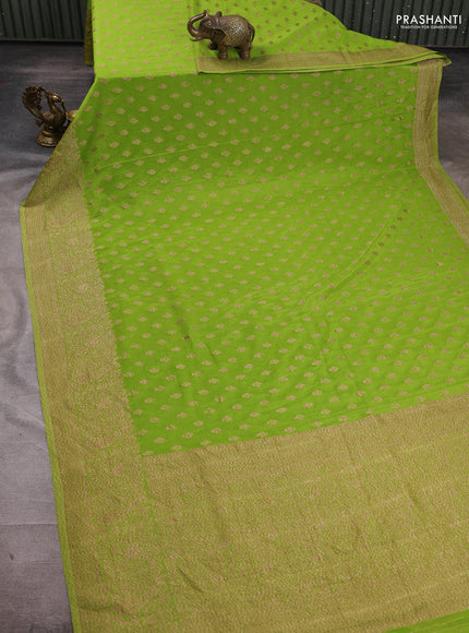Banarasi semi crepe saree light green with woven buttas and woven border
