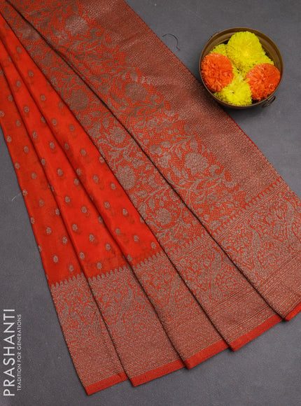 Banarasi semi crepe saree orange with woven buttas and woven border