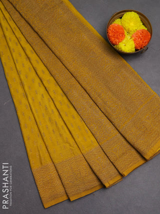Banarasi semi crepe saree yellow with allover woven buttas and woven border