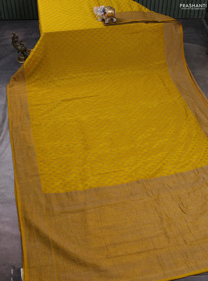 Banarasi semi crepe saree yellow with allover woven buttas and woven border