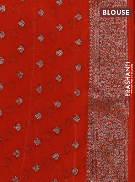 Banarasi semi crepe saree orange with woven buttas and woven border