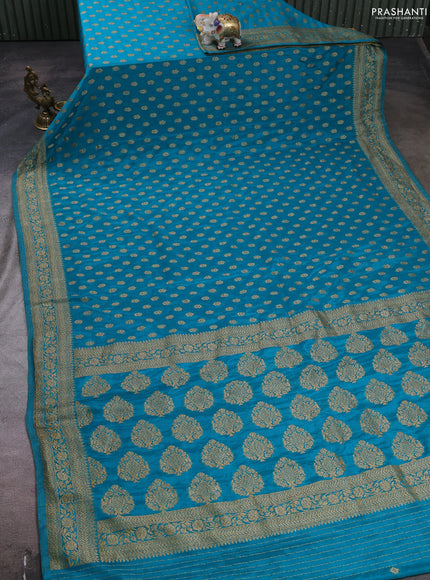 Banarasi semi crepe saree teal blue with allover woven buttas and woven border
