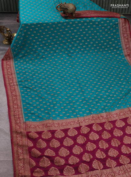 Banarasi semi crepe saree teal blue and maroon with allover woven buttas and woven border