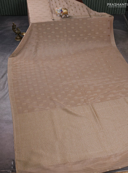 Banarasi semi crepe saree beige with allover woven buttas and woven border