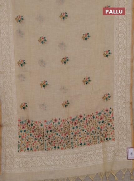 Linen cotton saree cream with embroidery buttas and embroidery pallu