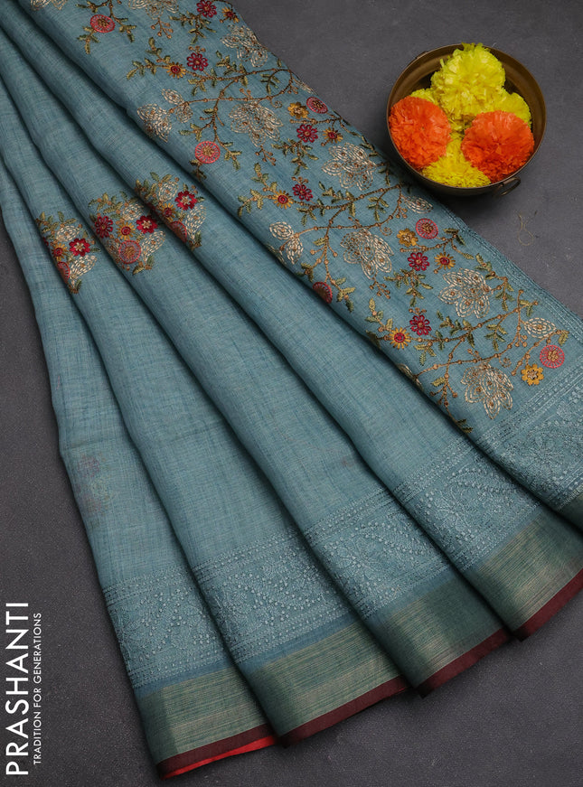 Tissue linen cotton saree teal blue with embroidery buttas and embroidery pallu