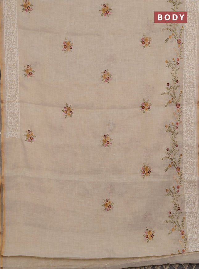 Linen cotton saree cream with embroidery buttas and embroidery border