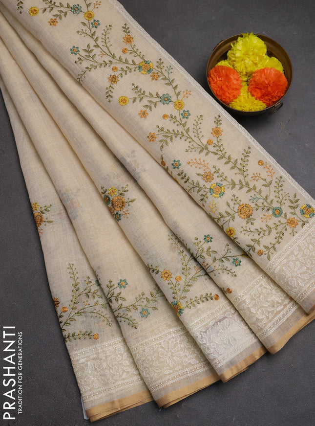 Linen cotton saree cream and yellow with embroidery buttas and embroidery border