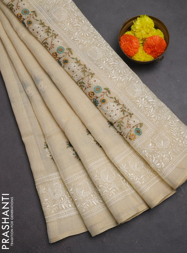 Linen cotton saree cream and peacock green with allover embroidery buttas and embroidery pallu
