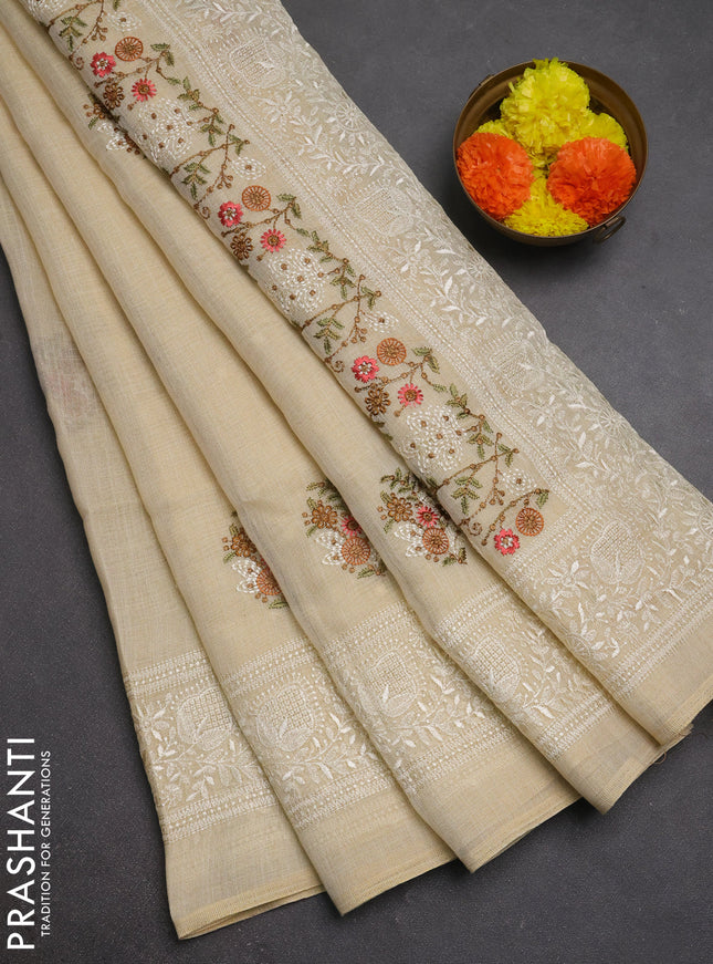 Linen cotton saree cream and pink with allover embroidery buttas and embroidery pallu