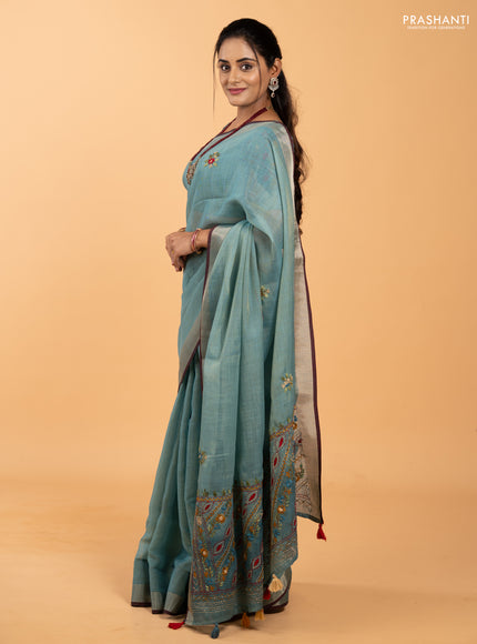 Tissue linen saree teal blue and maroon with allover embroidery buttas and embroidery kantha stitch work pallu