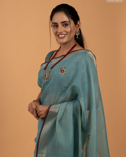 Tissue linen saree teal blue and maroon with allover embroidery buttas and embroidery kantha stitch work pallu