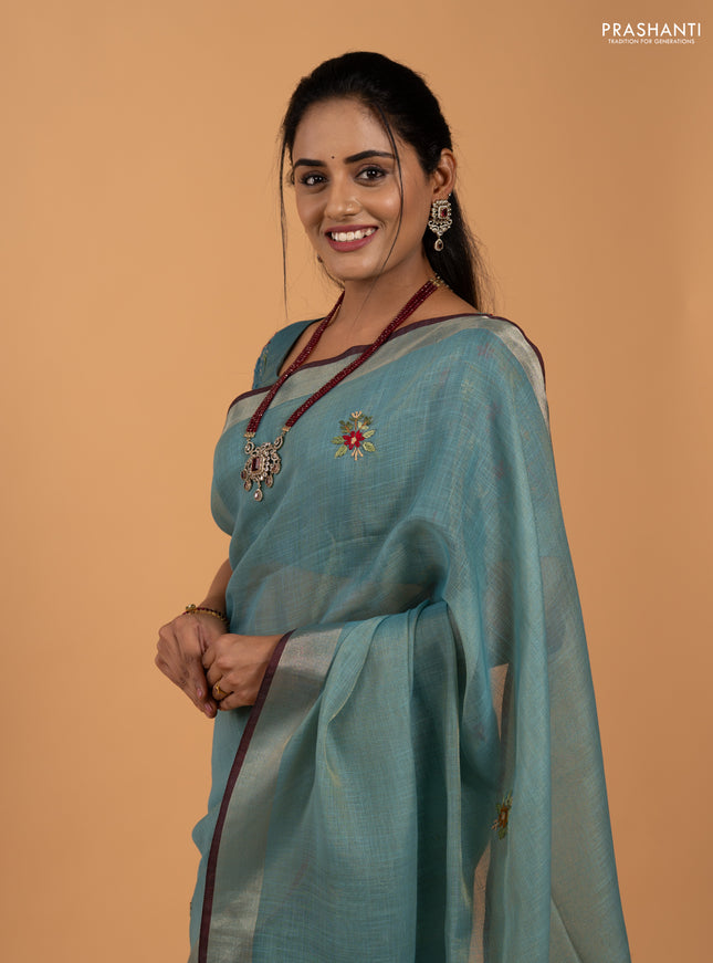 Tissue linen saree teal blue and maroon with allover embroidery buttas and embroidery kantha stitch work pallu