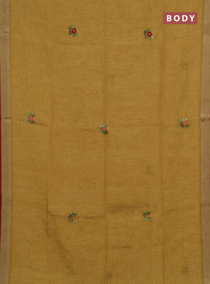 Tissue linen saree mustard green and red with allover embroidery buttas and embroidery kantha stitch work pallu