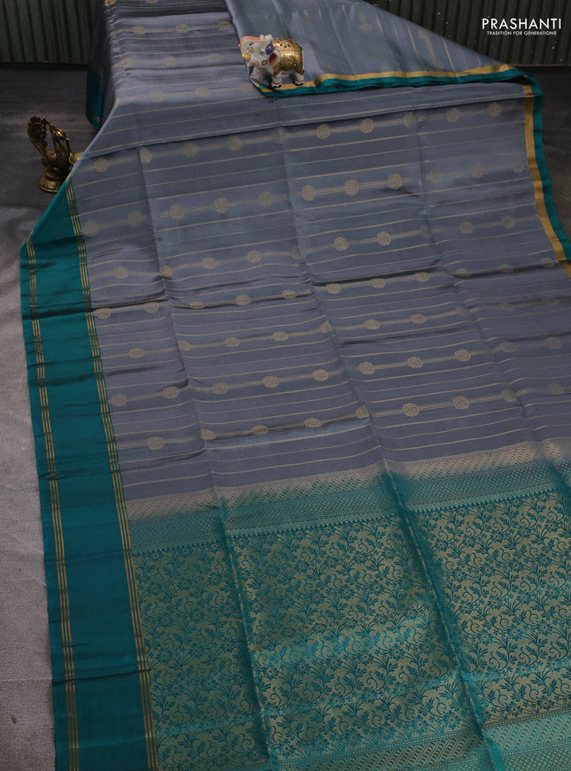 Pure soft silk saree grey and teal blue with allover zari stripes & buttas and rettapet zari woven border