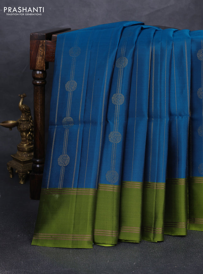 Pure soft silk saree peacock blue and light green with allover zari stripes & buttas and rettapet zari woven border