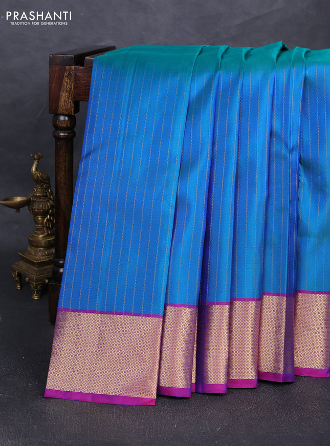 Pure soft silk saree dual shade of bluish green and purple with allover zari stripe pattern and zari woven border
