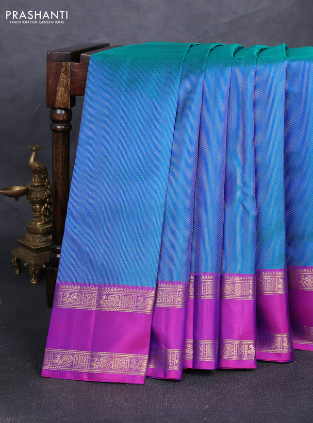 Pure soft silk saree dual shade of bluish green and purple with allover zari woven brocade weaves and rettapet zari woven border